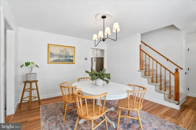 a utility room with fridge and a couch