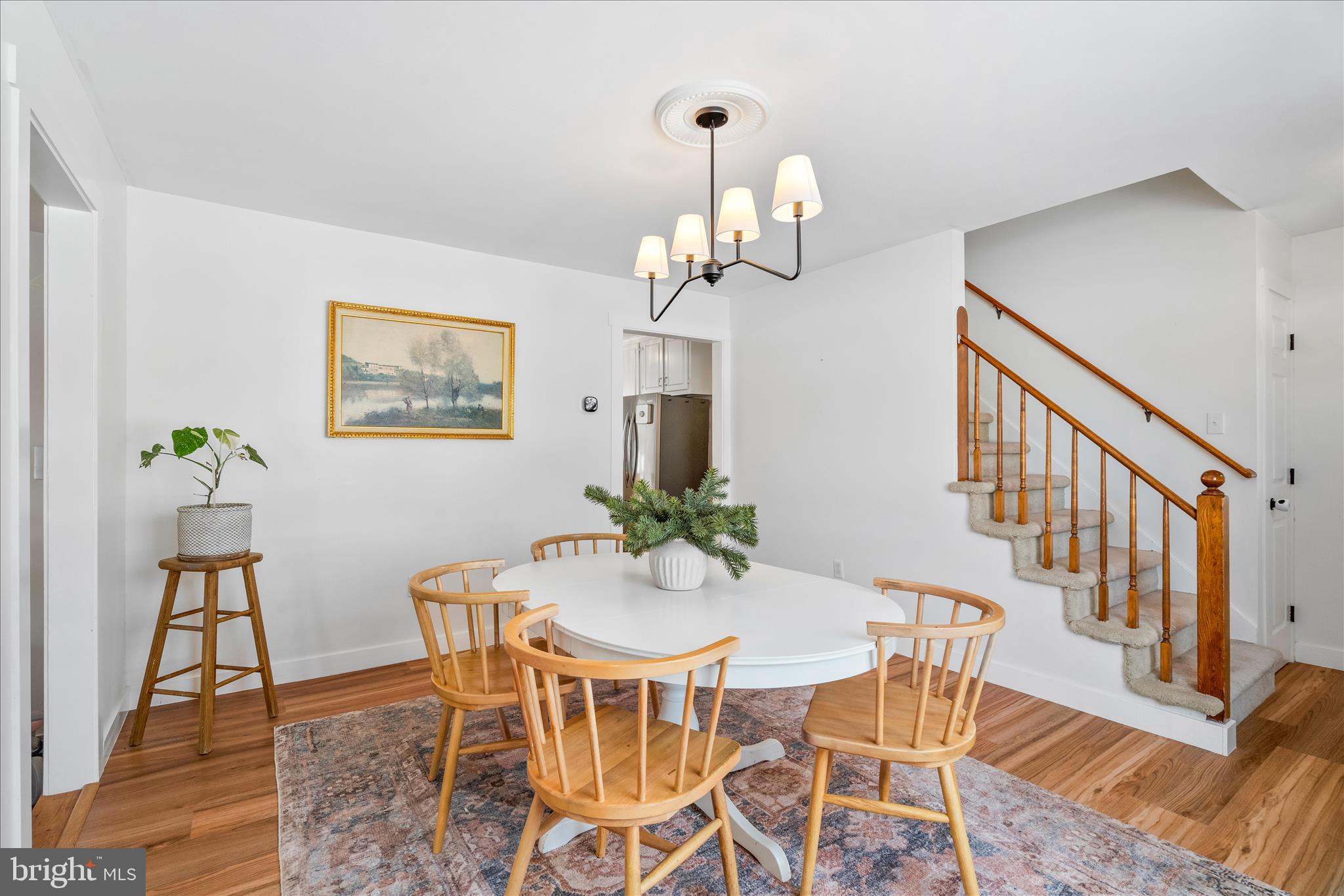 7997 Pleasant Court Frederick, MD 21701 - Photo 9 of 78 a view of a dining room with furniture wooden floor and chandelier