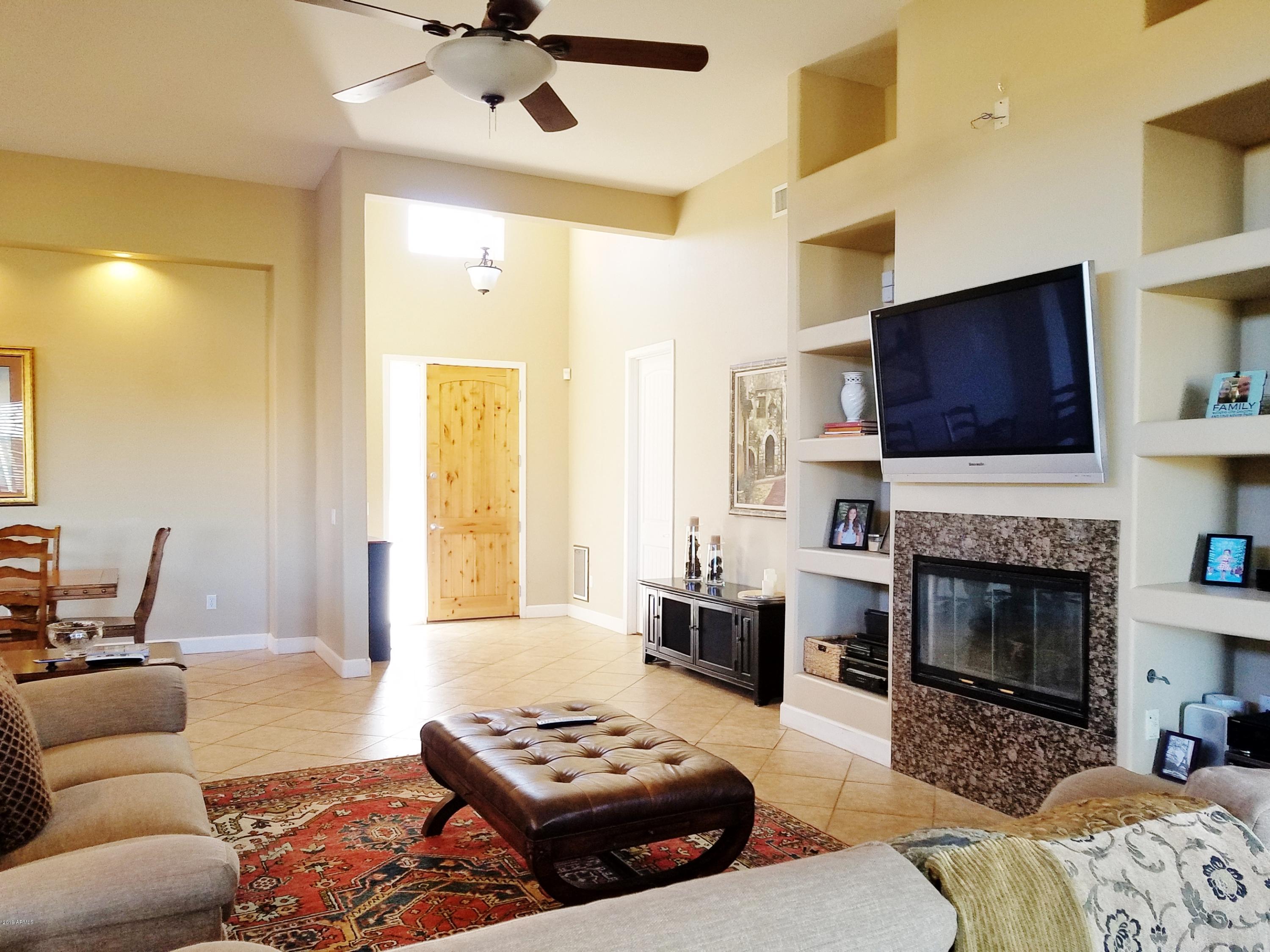 17424 West Ocotillo Road Waddell, AZ 85355 - Photo 2 of 38 Greatroom fireplace