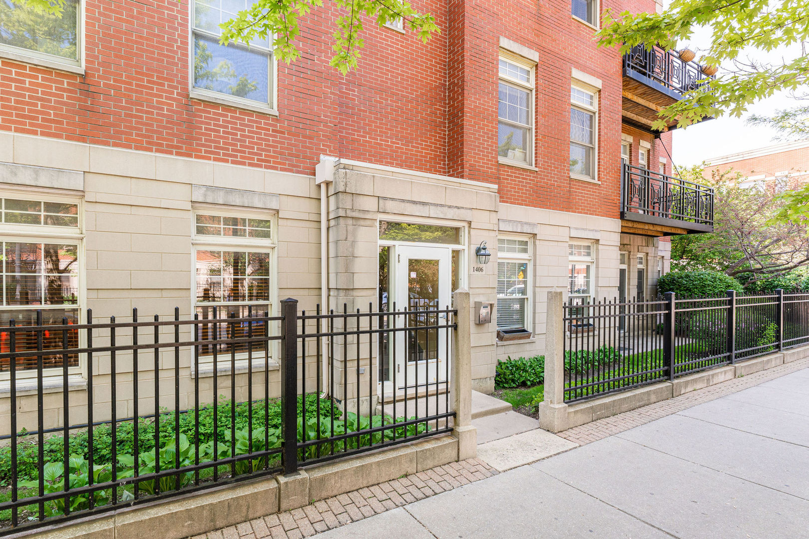 a view of a building with a iron fence