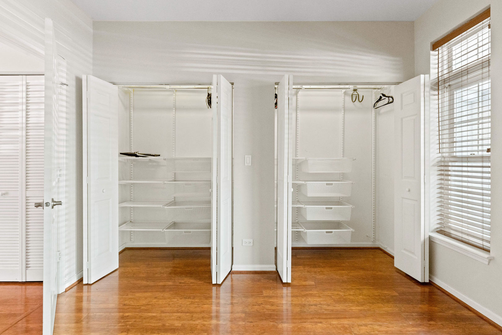 1406 South Halsted Street, Unit 1A Chicago, IL 60607 - Photo 11 of 25 a view of walk in closet with empty racks