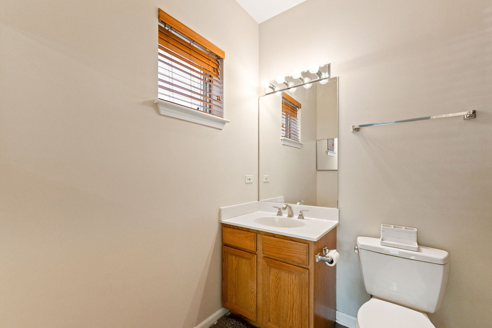 1406 South Halsted Street, Unit 1A Chicago, IL 60607 - Photo 12 of 25 a bathroom with a sink a toilet and mirror