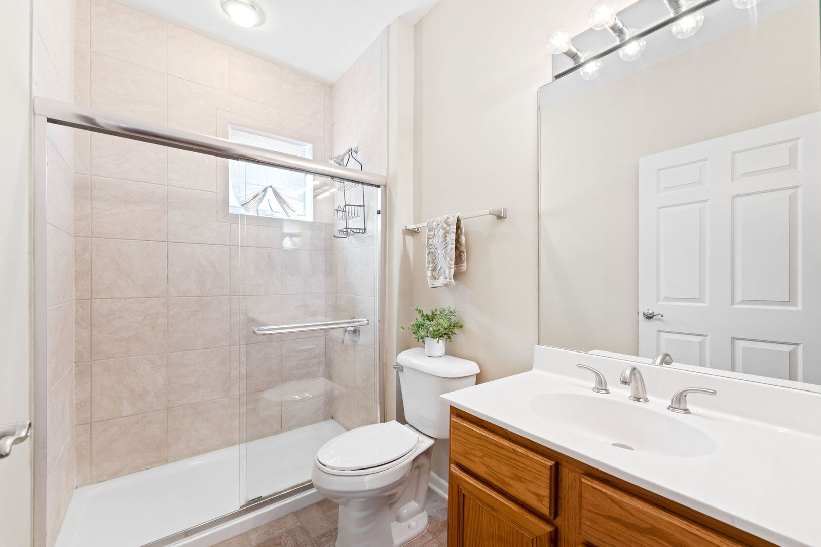 1406 South Halsted Street, Unit 1A Chicago, IL 60607 - Photo 17 of 25 a bathroom with a sink toilet and shower