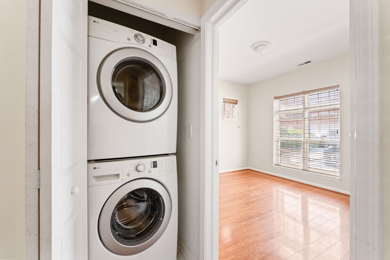 1406 South Halsted Street, Unit 1A Chicago, IL 60607 - Photo 18 of 25 a view of a hallway with washer and dryer