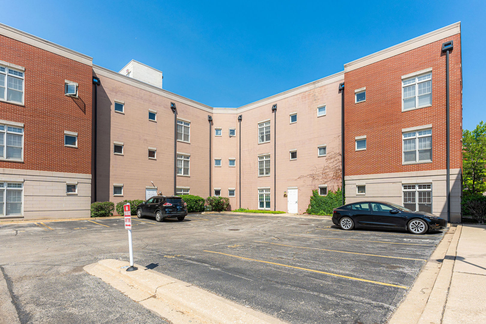 1406 South Halsted Street, Unit 1A Chicago, IL 60607 - Photo 23 of 25 a car parked in front of a building