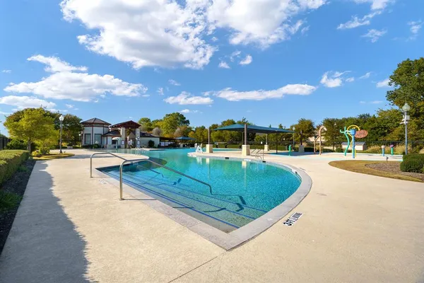 a view of a swimming pool with a lounge chairs