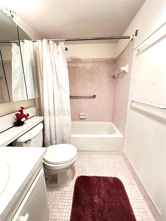 57 Markham C, Unit 57 Deerfield Beach, FL 33442 - Photo 24 of 76 a bathroom with a sink toilet and shower