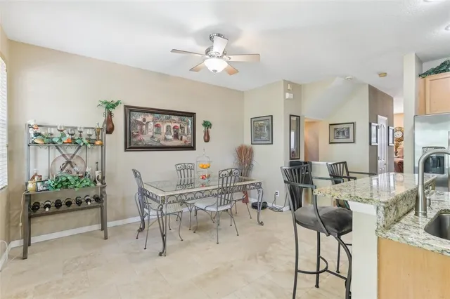 a view of a hallway with furniture and a large window