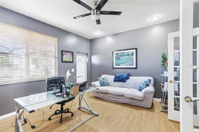 a bedroom with a bed next to a window