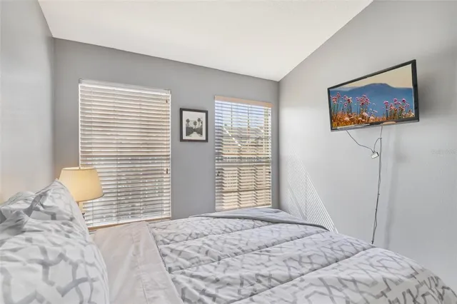 a bedroom with furniture and a window