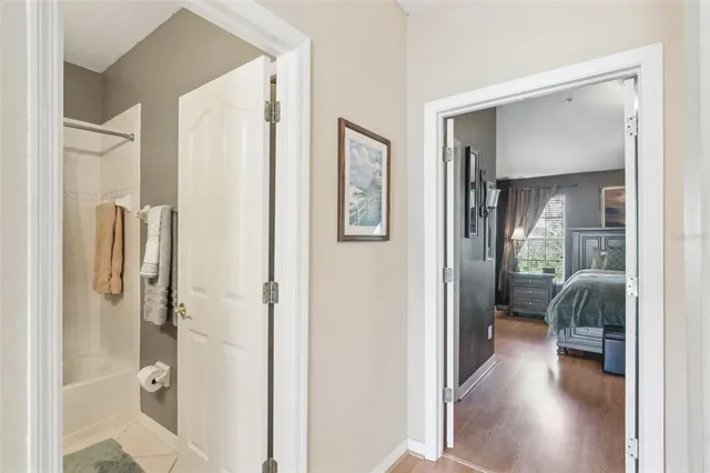 a view of a yard in front of a house with large trees