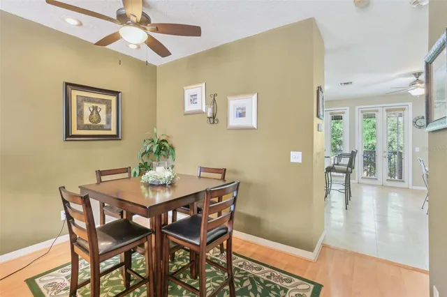 a view of a dining room with furniture and a livingroom