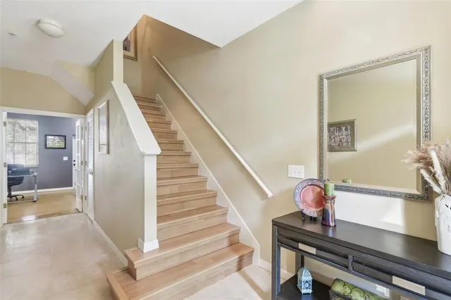 a room with round table and mirror
