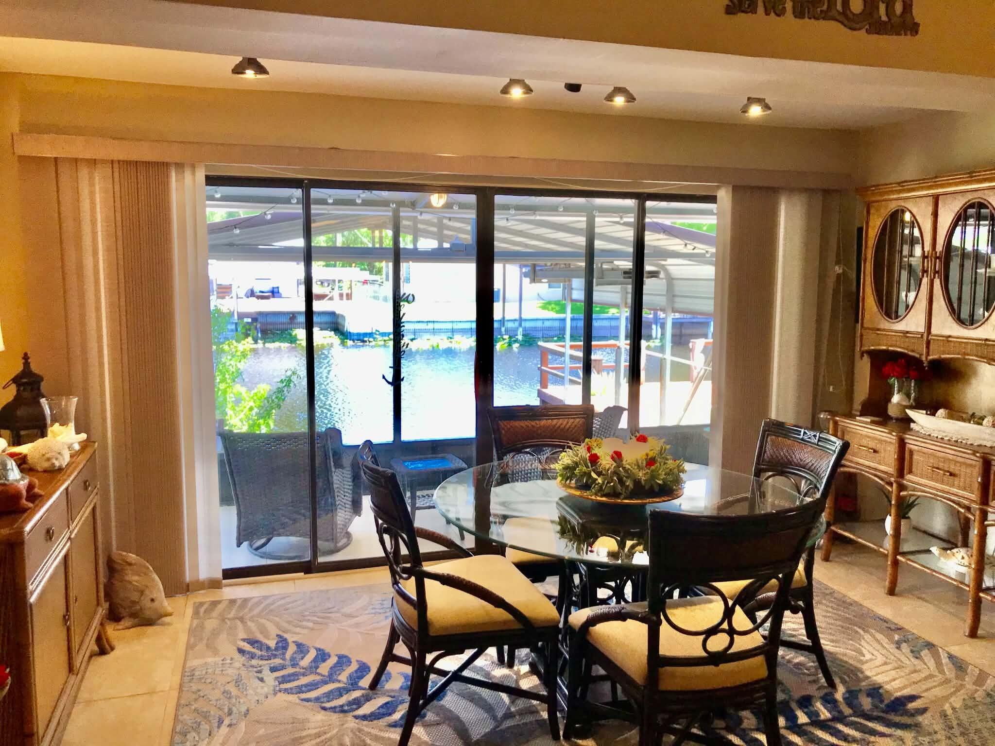 1115 Elm Street Okeechobee, FL 34974 - Photo 13 of 37 a dining room with furniture and window