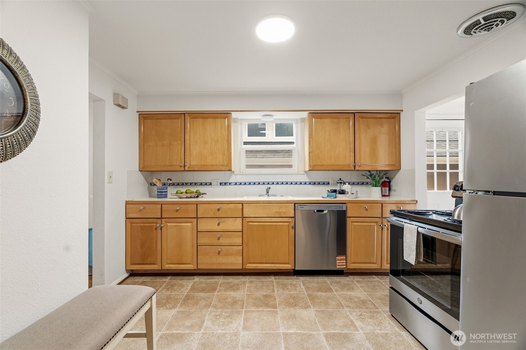 921 North 50th Street Seattle, WA 98103 - Photo 14 of 32 a kitchen with stainless steel appliances granite countertop a sink and a stove