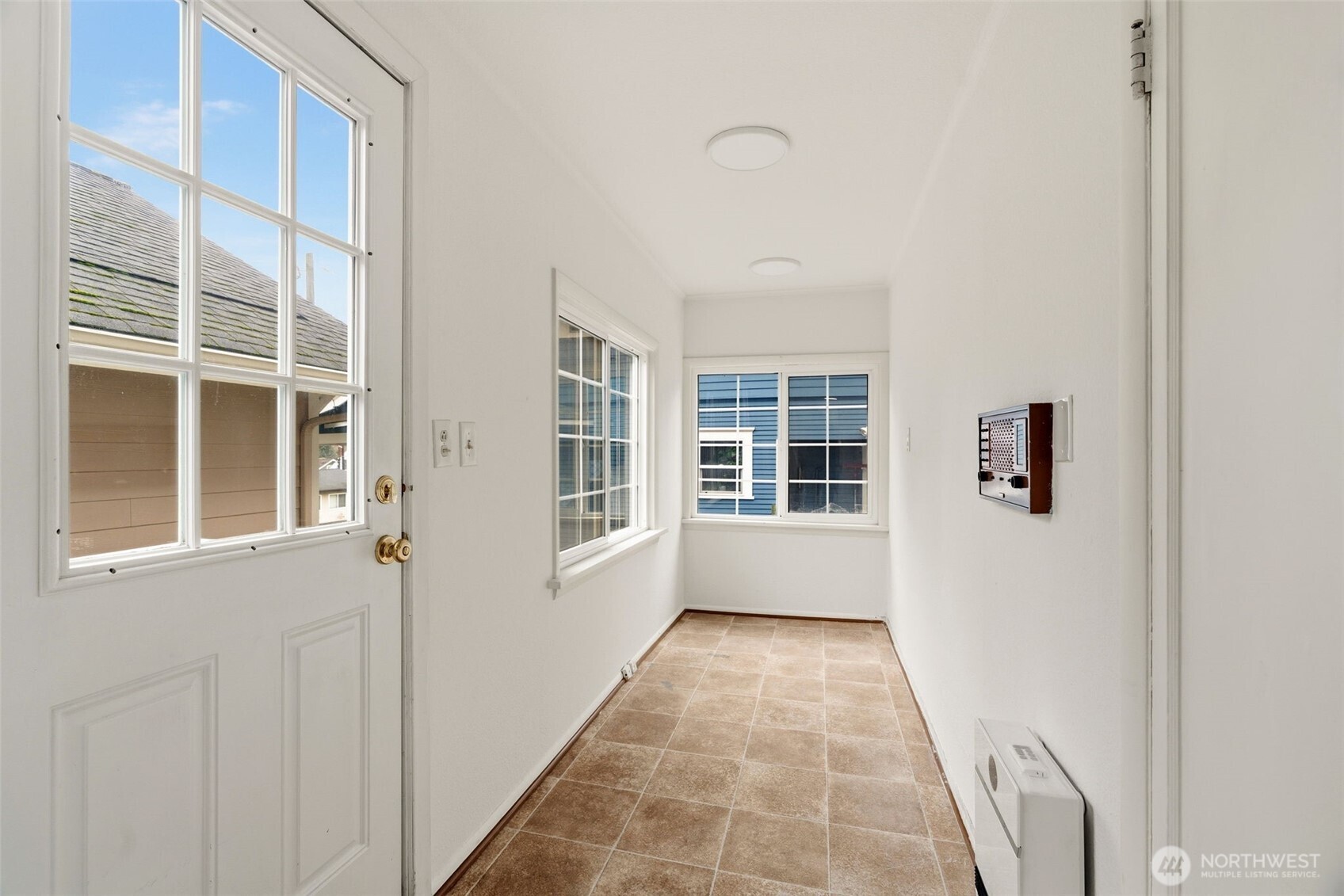 921 North 50th Street Seattle, WA 98103 - Photo 17 of 32 a view of an empty room with a window