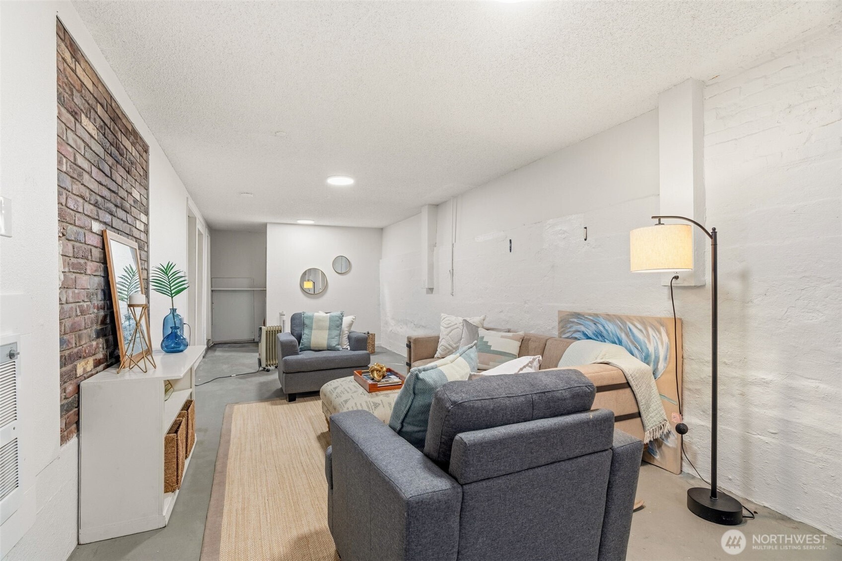 921 North 50th Street Seattle, WA 98103 - Photo 24 of 32 a living room with furniture and a fireplace