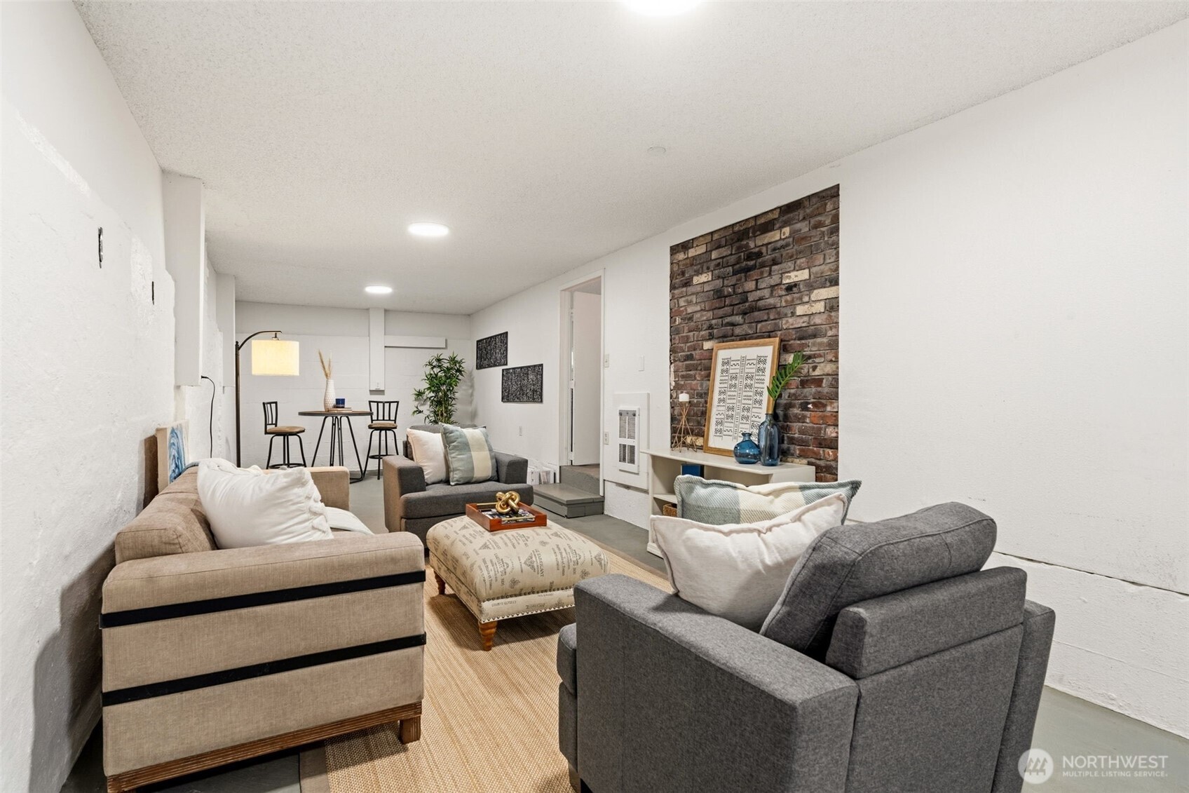 921 North 50th Street Seattle, WA 98103 - Photo 25 of 32 a living room with furniture and a large window
