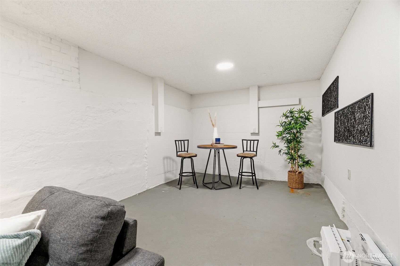 921 North 50th Street Seattle, WA 98103 - Photo 26 of 32 a living room with furniture and flowers