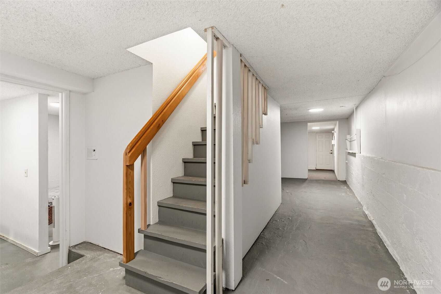 921 North 50th Street Seattle, WA 98103 - Photo 30 of 32 a view of a hallway with staircase