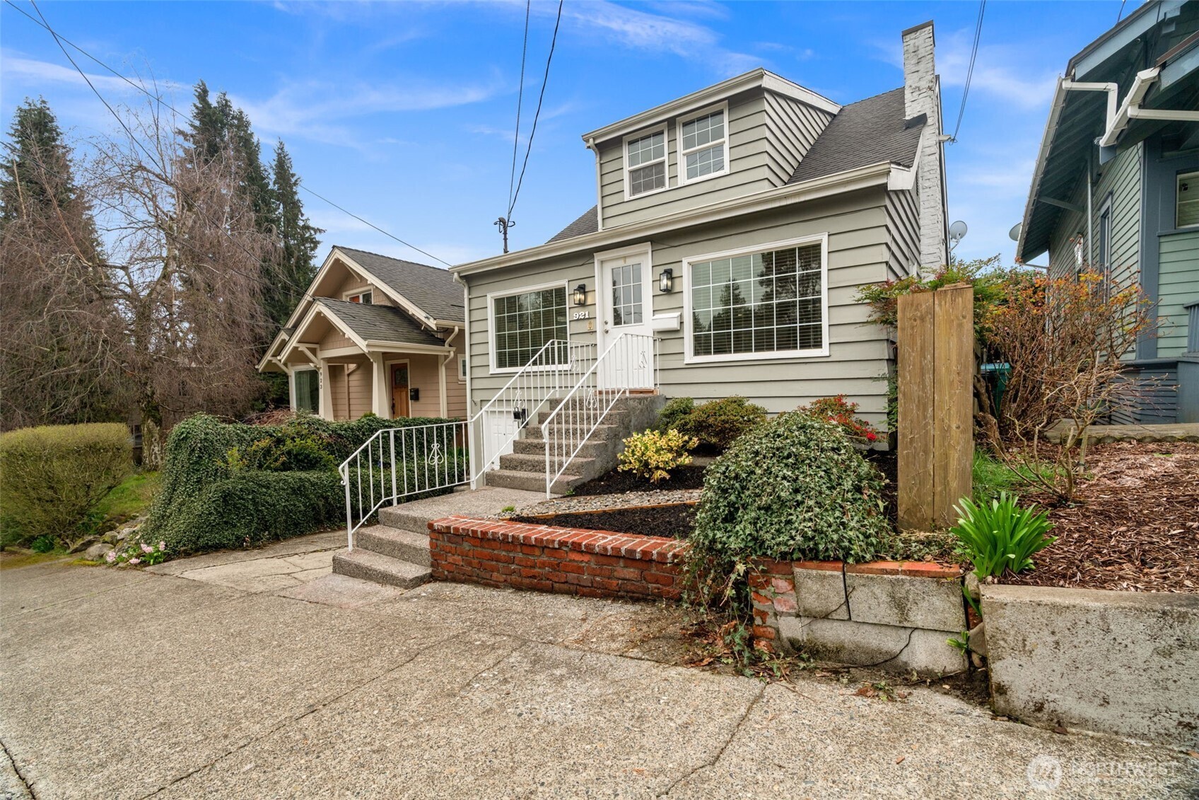 921 North 50th Street Seattle, WA 98103 - Photo 4 of 32 a view of a house with a yard and sitting area