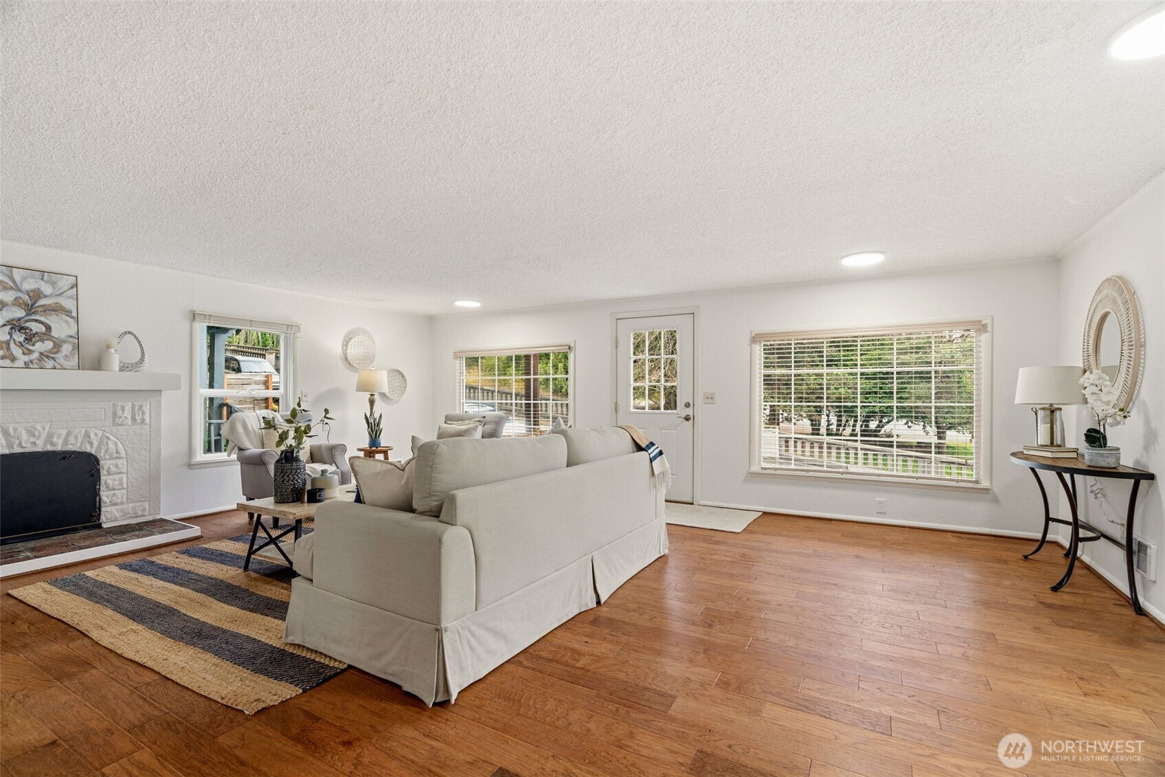 921 North 50th Street Seattle, WA 98103 - Photo 8 of 32 a living room with furniture large window and wooden floor