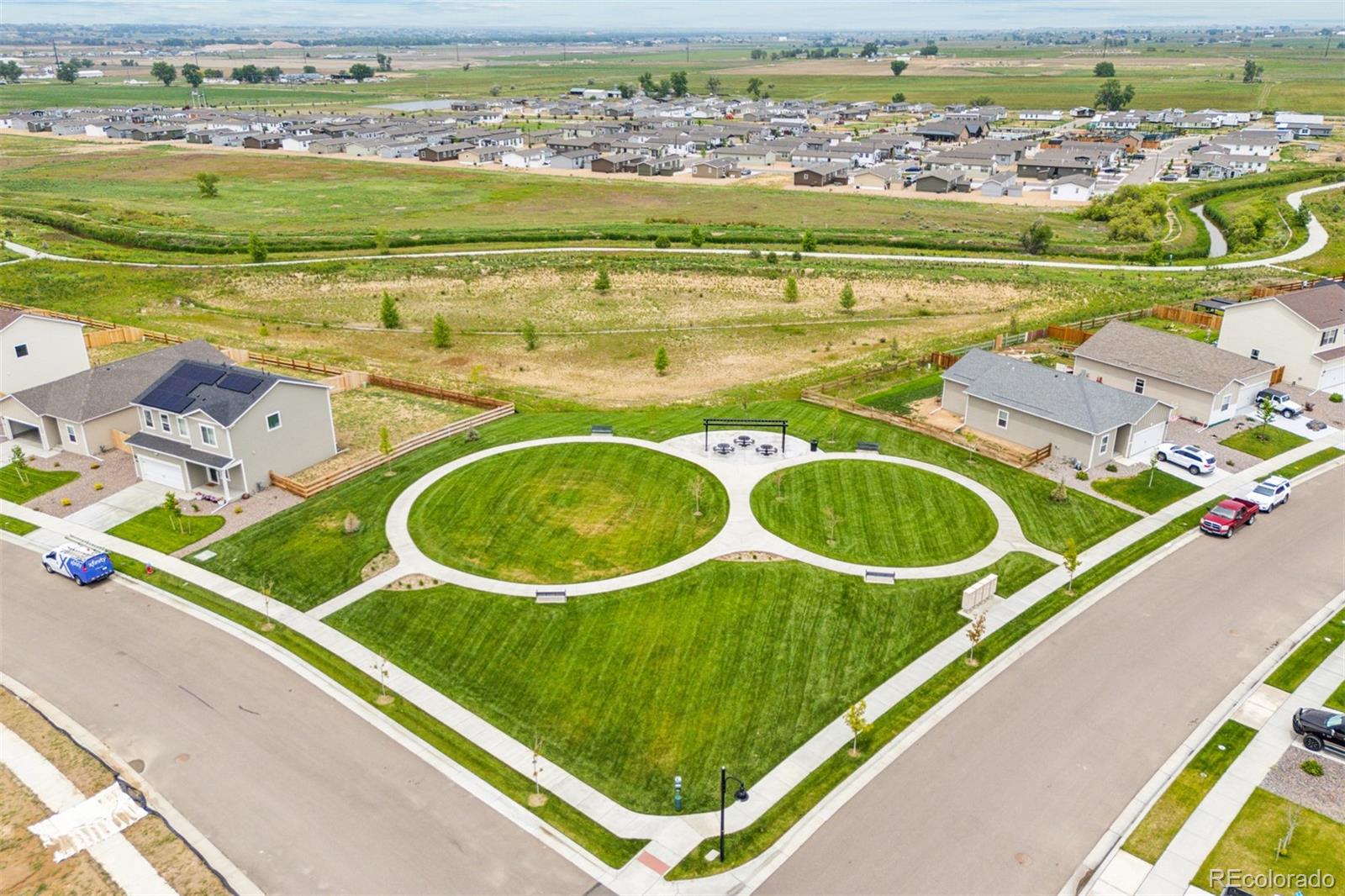 2144 Alyssa Street Fort Lupton, CO 80621 - Photo 28 of 38 an aerial view of a house with a swimming pool
