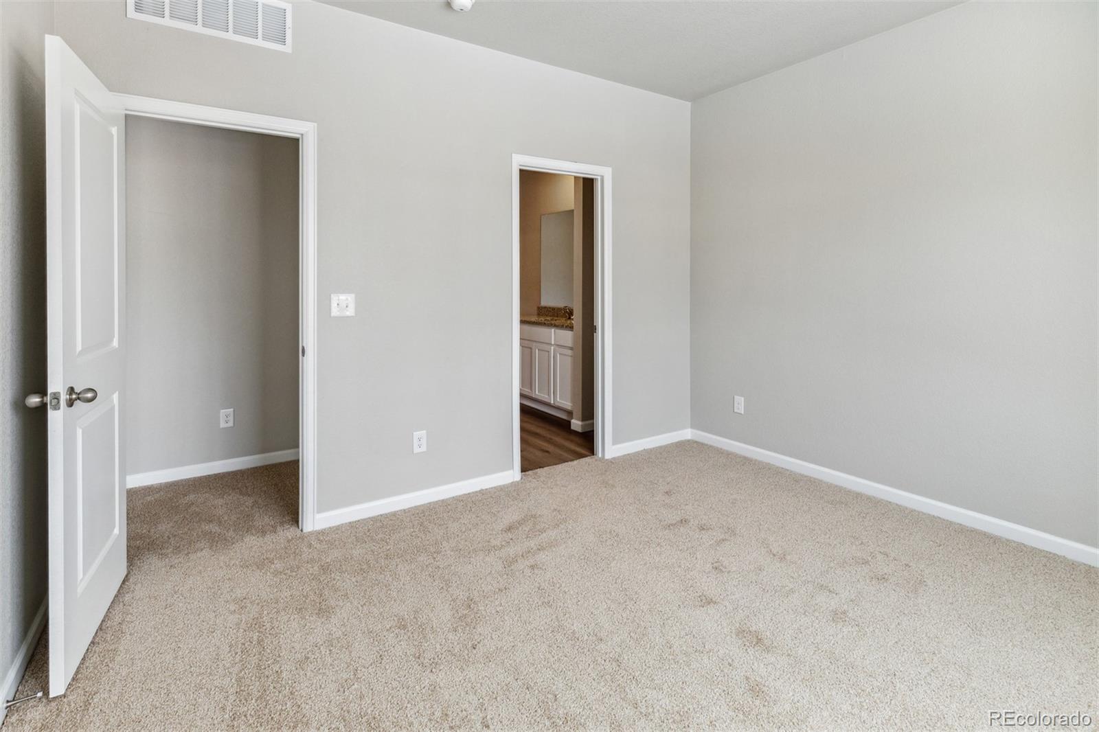 2144 Alyssa Street Fort Lupton, CO 80621 - Photo 10 of 38 an empty room with closet and a bathroom