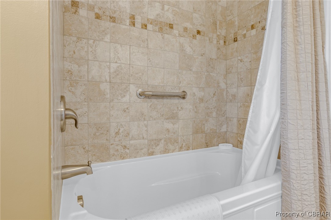 86 Greenfield Road Lancaster, VA 22503 - Photo 36 of 44 Bathroom featuring shower / bath combination with curtain