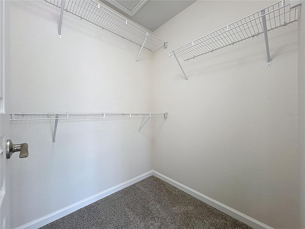 12930 Vennetta Way Windermere, FL 34786 - Photo 19 of 38 a view of a room with racks on the wall