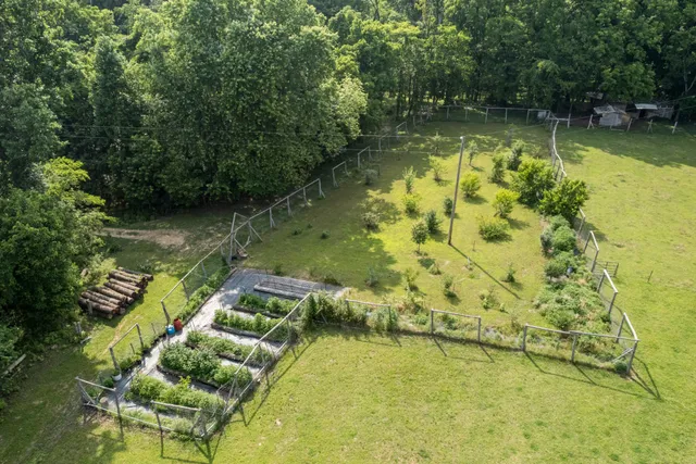 a view of swimming pool with a yard
