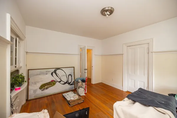 a bedroom with a bed and a table in it