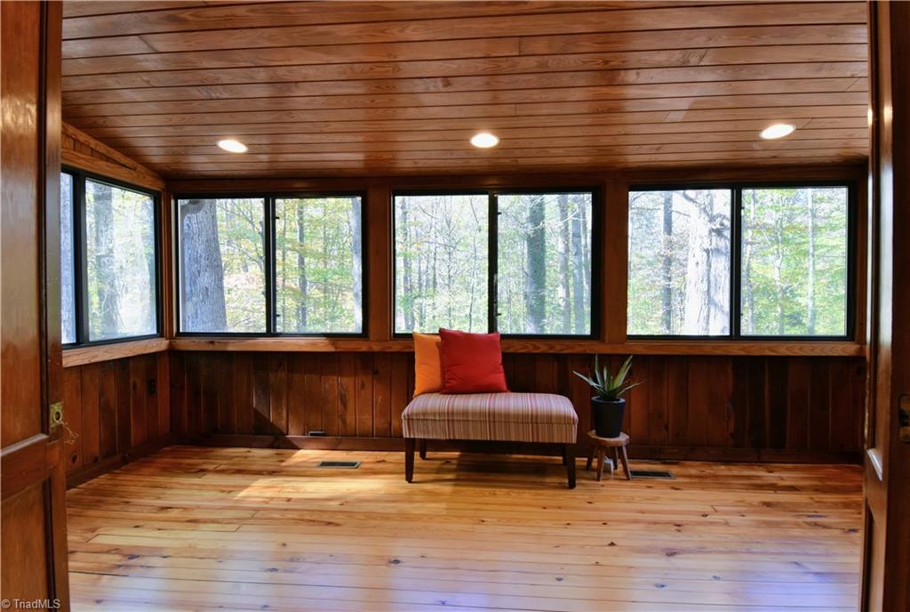 6068 Hedgerow Circle Clemmons, NC 27012 - Photo 11 of 35 This sunroom has large windows on 3 sides - and is the perfect place to ease into the day with your morning coffee.