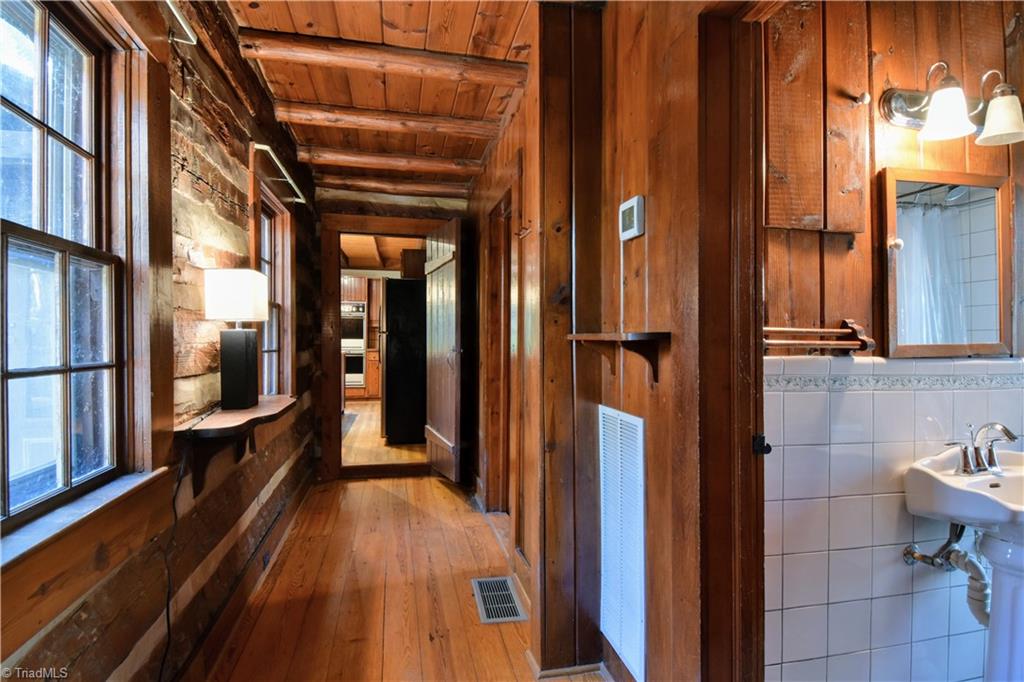 6068 Hedgerow Circle Clemmons, NC 27012 - Photo 19 of 35 Window-lit hallway heads towards the kitchen.