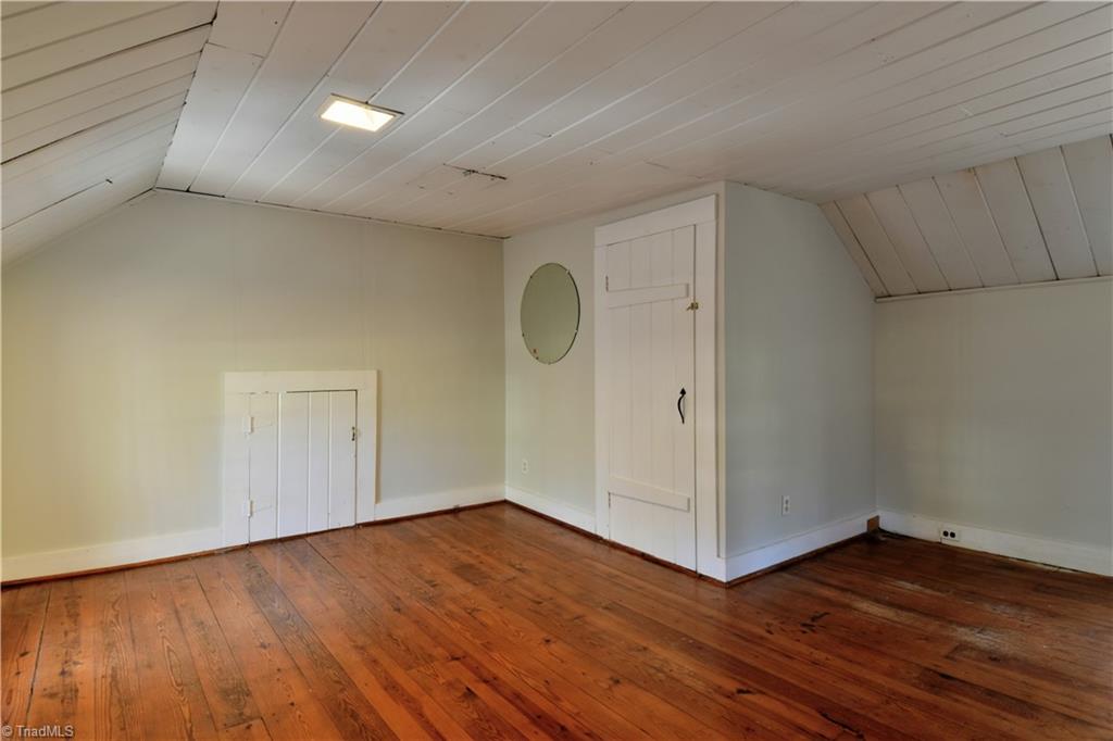 6068 Hedgerow Circle Clemmons, NC 27012 - Photo 21 of 35 Upper level 3rd bedroom feels like a fairy-tale cottage. Access to attic and large walk-in closet. Or open this even more by removing the closet area and adding a wardrobe and built-ins.