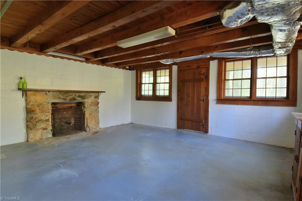 6068 Hedgerow Circle Clemmons, NC 27012 - Photo 25 of 35 Second basement room with exterior access under cover of the upper level porch. More incredible lighting for a basement area and the site of gorgeous fireplace #5