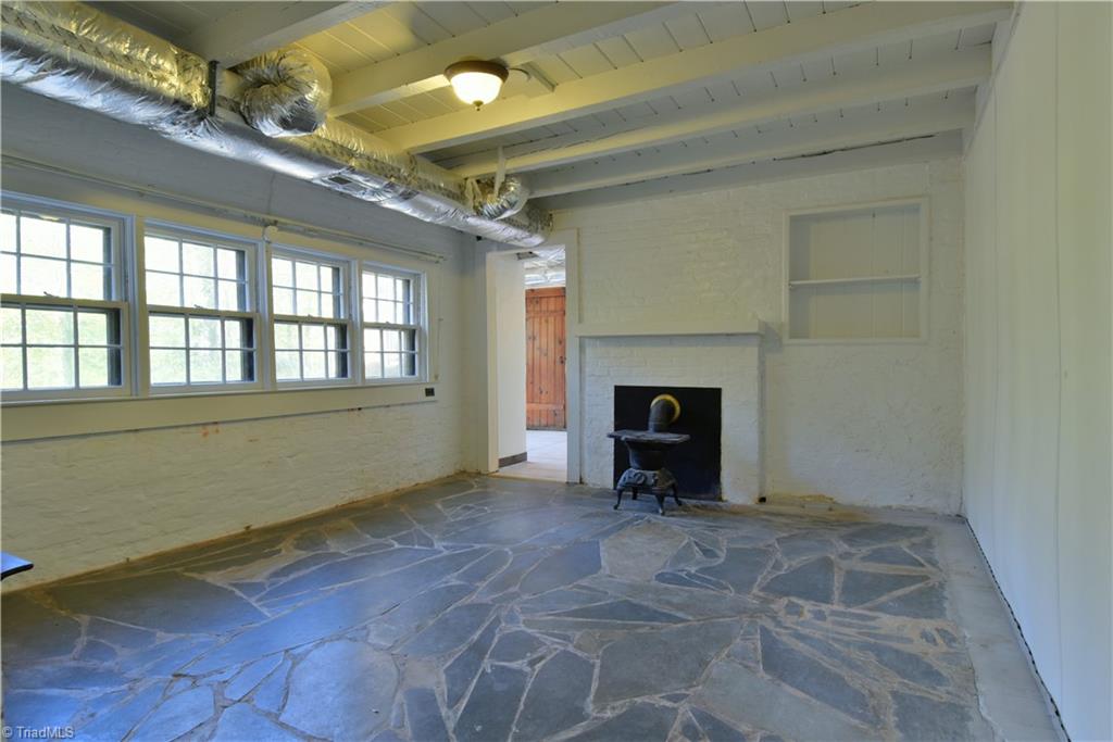6068 Hedgerow Circle Clemmons, NC 27012 - Photo 26 of 35 This slate-floored room is also in the basement and the location of fireplace/wood stove #6!