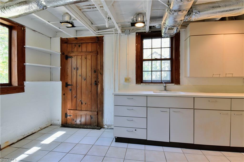 6068 Hedgerow Circle Clemmons, NC 27012 - Photo 27 of 35 This basement level room is the perfect spot for canning room or art/pottery studio.