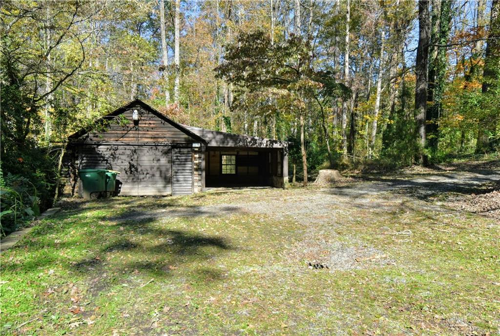 6068 Hedgerow Circle Clemmons, NC 27012 - Photo 31 of 35 Detached garage area has two spaces on this side and another space from the lower rear.