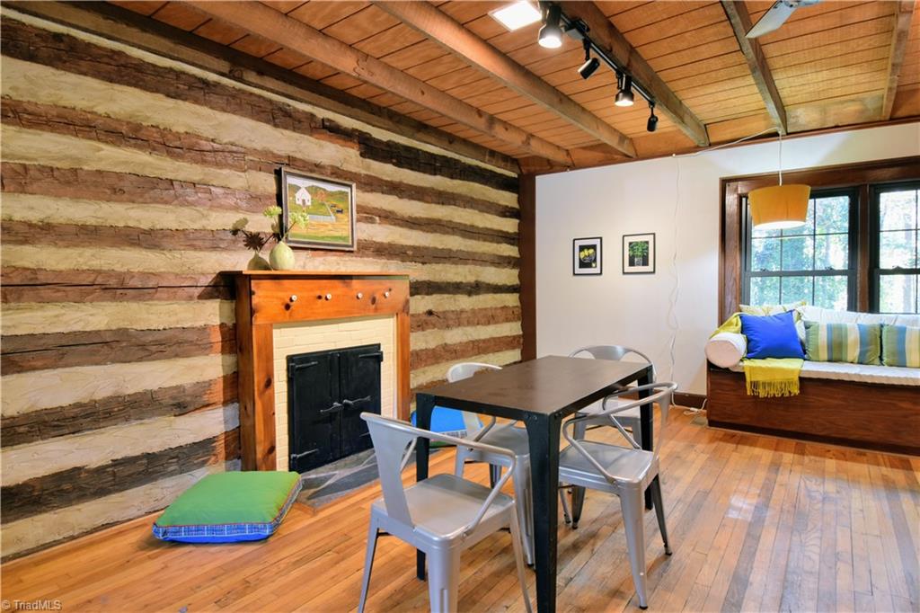 6068 Hedgerow Circle Clemmons, NC 27012 - Photo 9 of 35 Dining area accented with fireplace #2 on this gorgeous log wall.