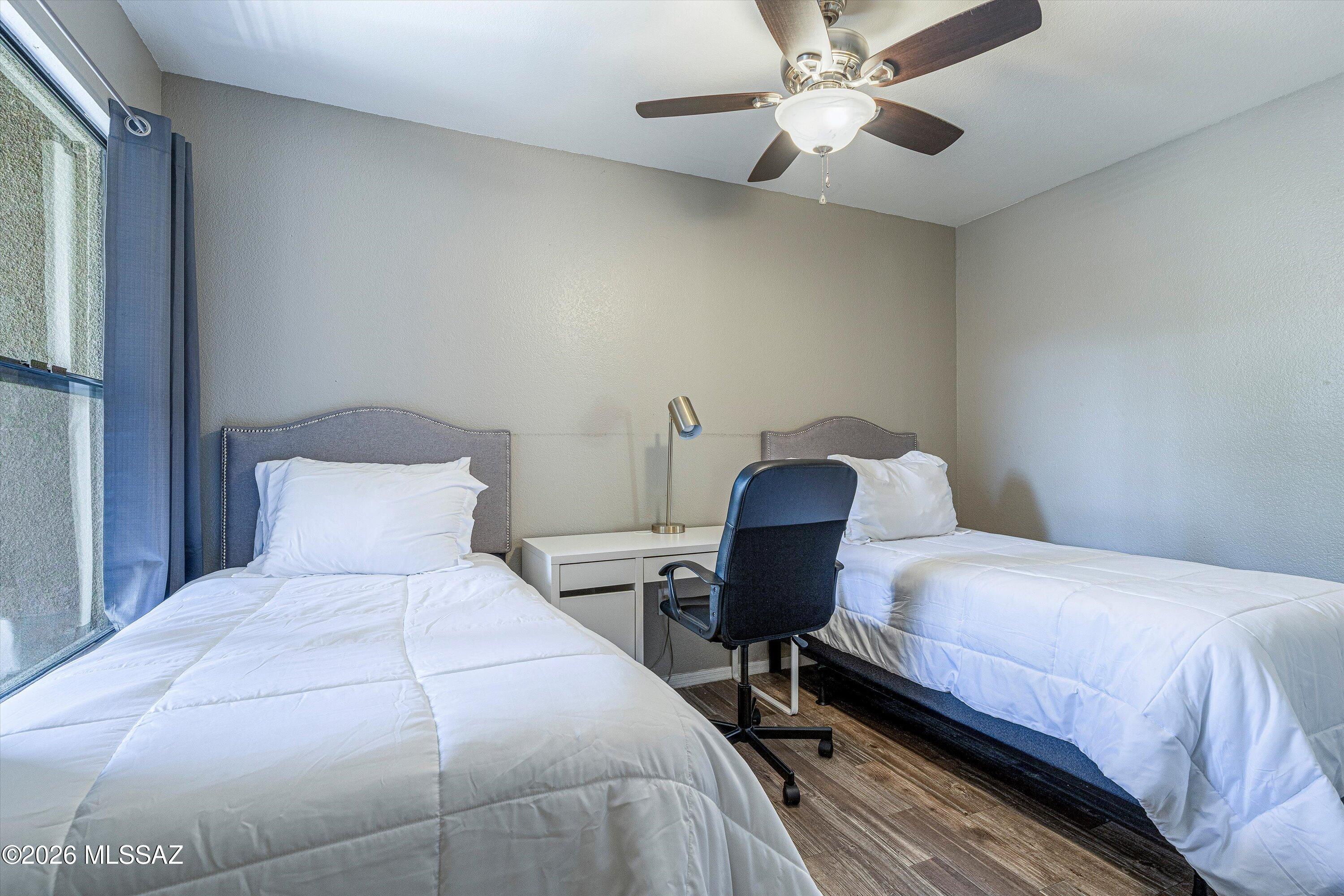 5855 North Kolb Road, Unit 8106 Tucson, AZ 85750 - Photo 16 of 34 a bedroom with a bed and a chandelier