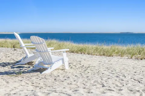 a view of a glass door with a yard from a window