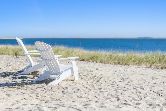 a view of a glass door with a yard from a window