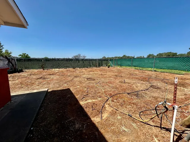 a view of ocean view with large space and wooden fence