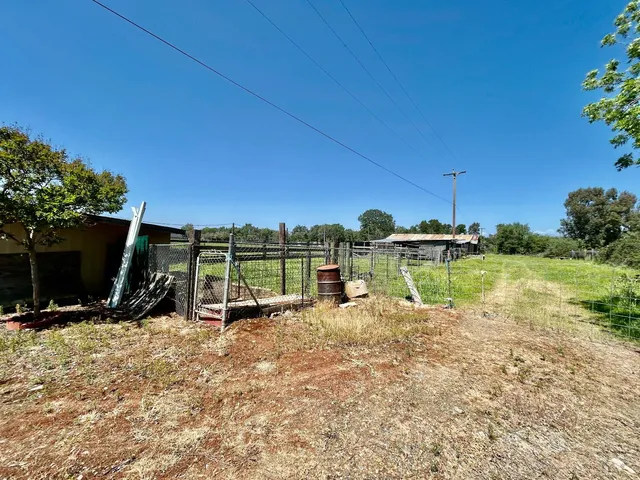 a view of a lake with a house in the background