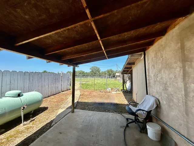 a room with furniture and a floor to ceiling window