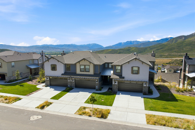 6039 North Westridge Road Heber City, UT 84032 - Photo 60 of 71 Multi-unit residence featuring a gabled roofline, stone and stucco exterior, and attached garages