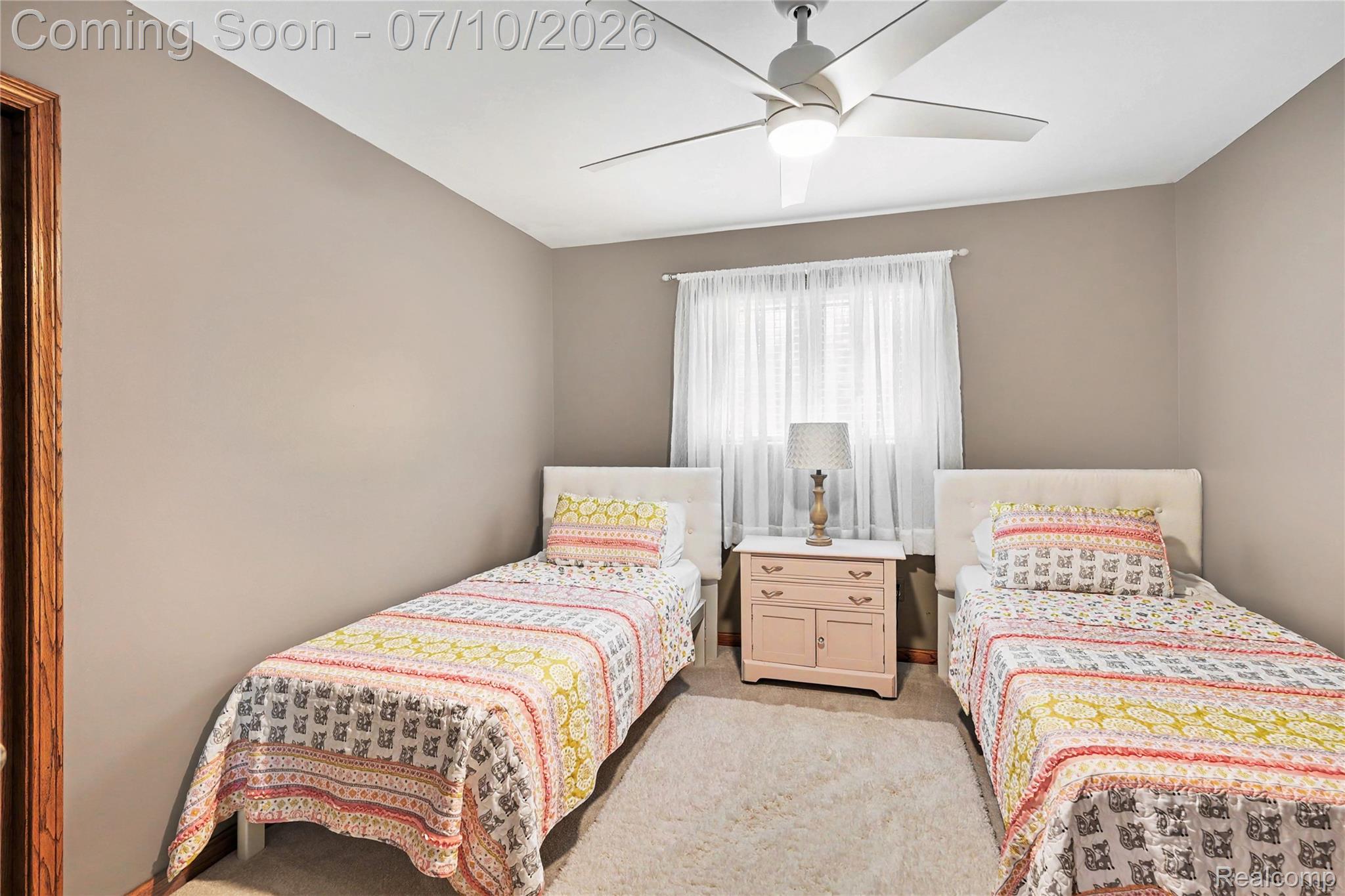 2180 Hurst Road St. Clair, MI 48079 - Photo 22 of 39 Room featuring neutral wall paint, a ceiling fan with integrated lighting, and a window with sheer white curtains