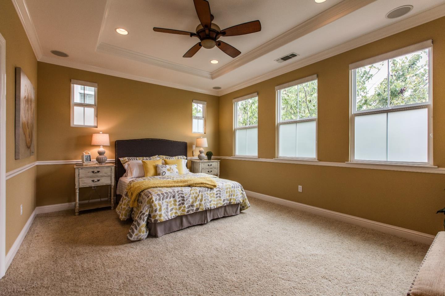 335 Ascente Commons San Jose, CA 95125 - Photo 14 of 38 a spacious bedroom with a bed and a chandelier