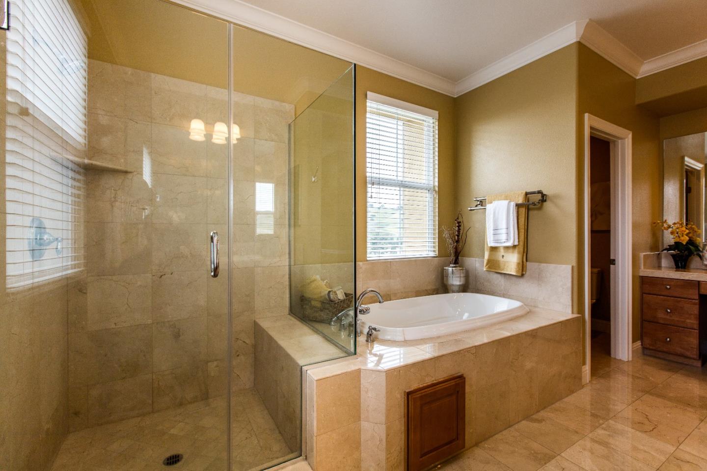 335 Ascente Commons San Jose, CA 95125 - Photo 17 of 38 a spacious bathroom with a granite countertop sink a mirror and shower